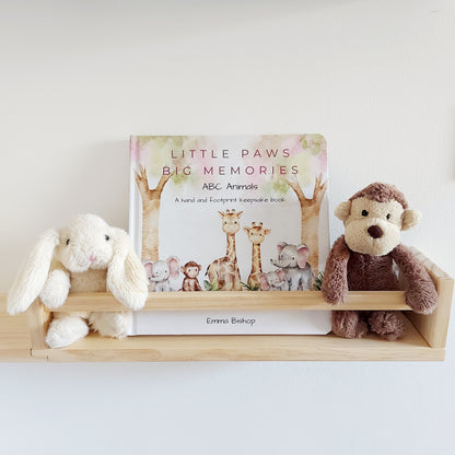 Little Paws Big Memories ABC Animals baby handprint and footprint keepsake memory book kit. Book on nursery shelf with soft toy monkey and rabbit. Newborn baby gift idea, baby shower gift idea. Christening present. 