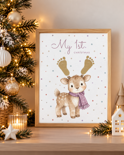 A framed personalized Christmas art print featuring a watercolor reindeer with gold footprints for antlers and the text 'My 1st. Christmas'.