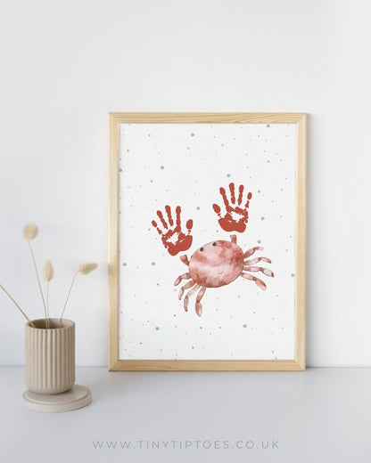 Framed artwork with handprint crab design on a white background