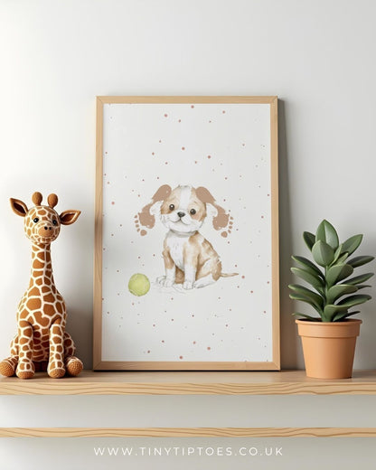 Framed print of a puppy with footprint ears with a toy, sitting on a shelf next to a stuffed giraffe and a potted plant.