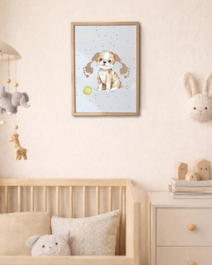 Framed children's poster of a dog on a wall above a cot with toys in a nursery. dog ears are made from baby footrpints