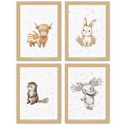 Set of four framed baby animal art prints featuring a Highland cow, bunny, otter, and elephant with handprints and footprints on a white background with tiny colorful speckles, in light wood frames.