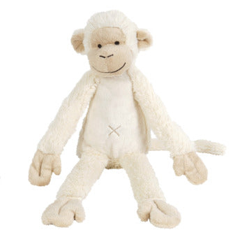 White monkey plush toy on a white background