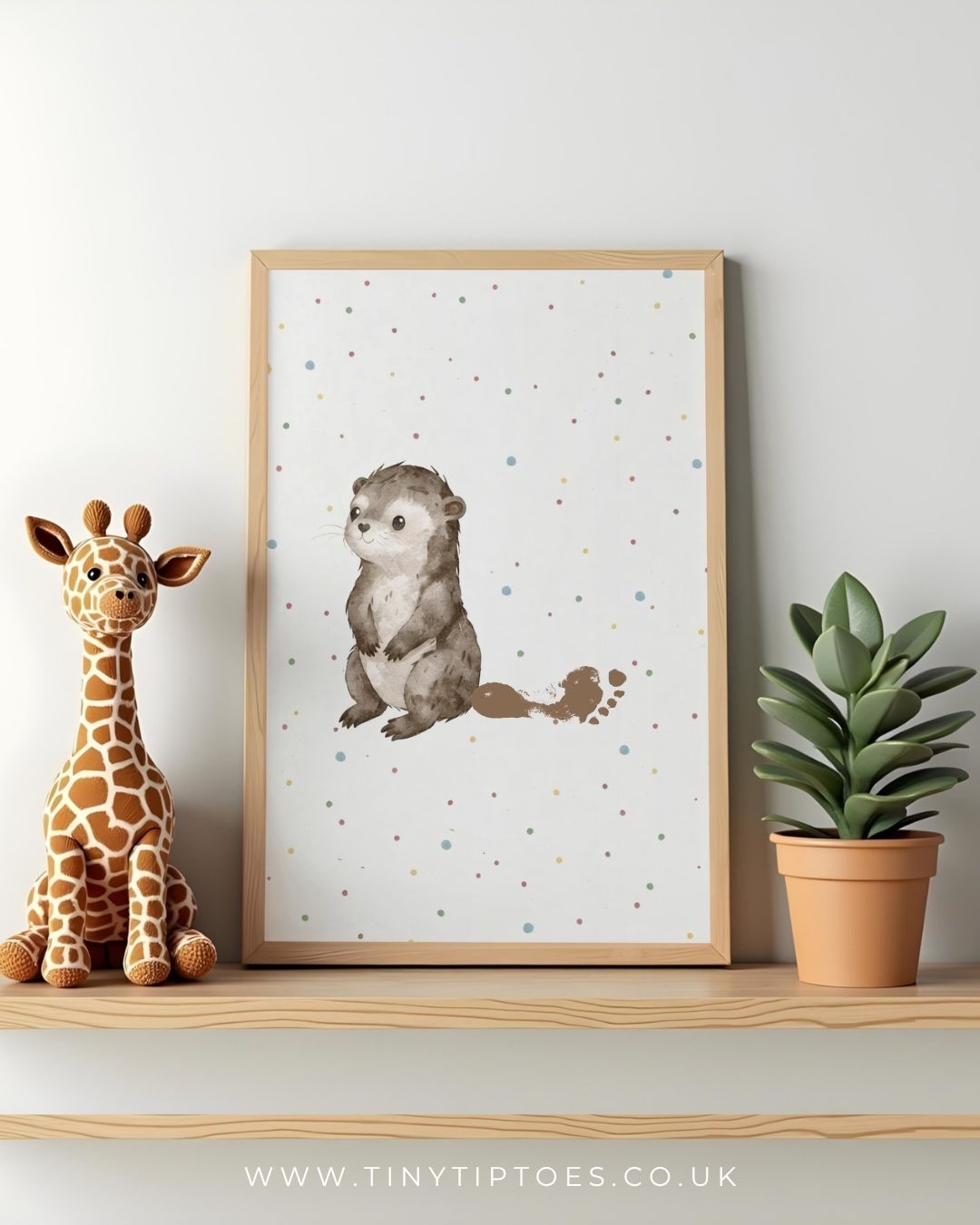 Framed children's illustration of an otter with footprint on a shelf with a toy giraffe and plant.