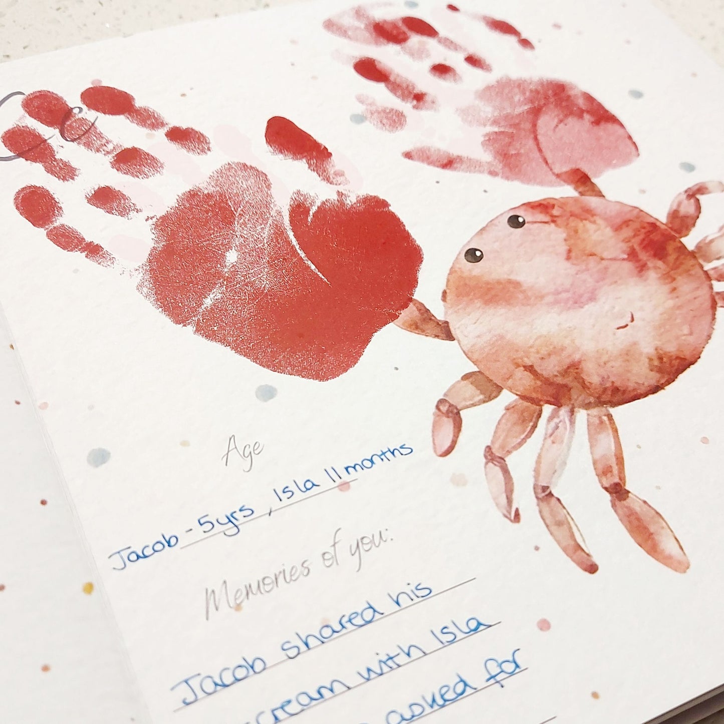 Handprint crab art with handwritten text on a white background