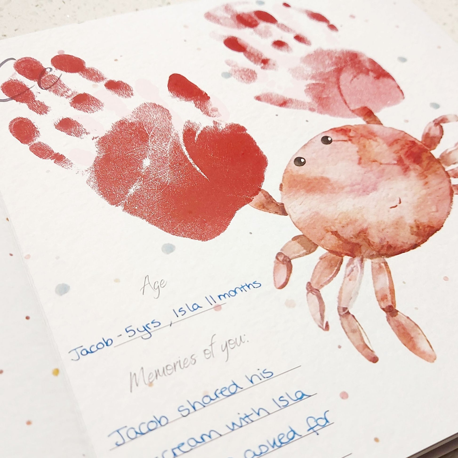 Handprint crab art with handwritten text on a white background