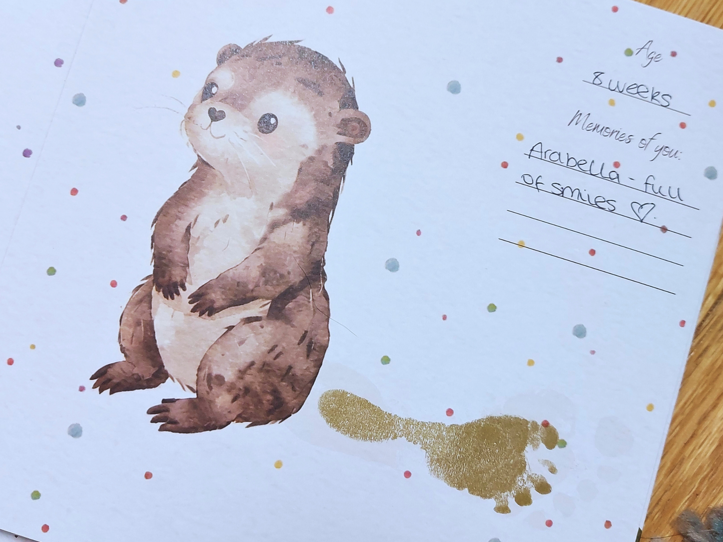 Illustration of a baby otter with a footprint tail and memories written next to it