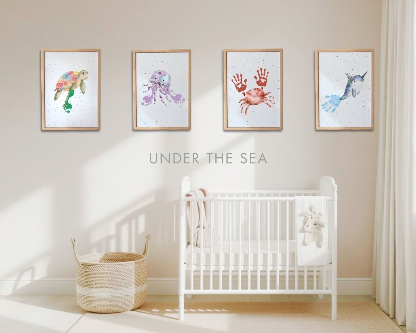 Nursery room with 'Under the Sea' themed wall art above a white crib. turtle, jellyfish, crab and narwhal handprint and footprint nursery wall art framed prints.