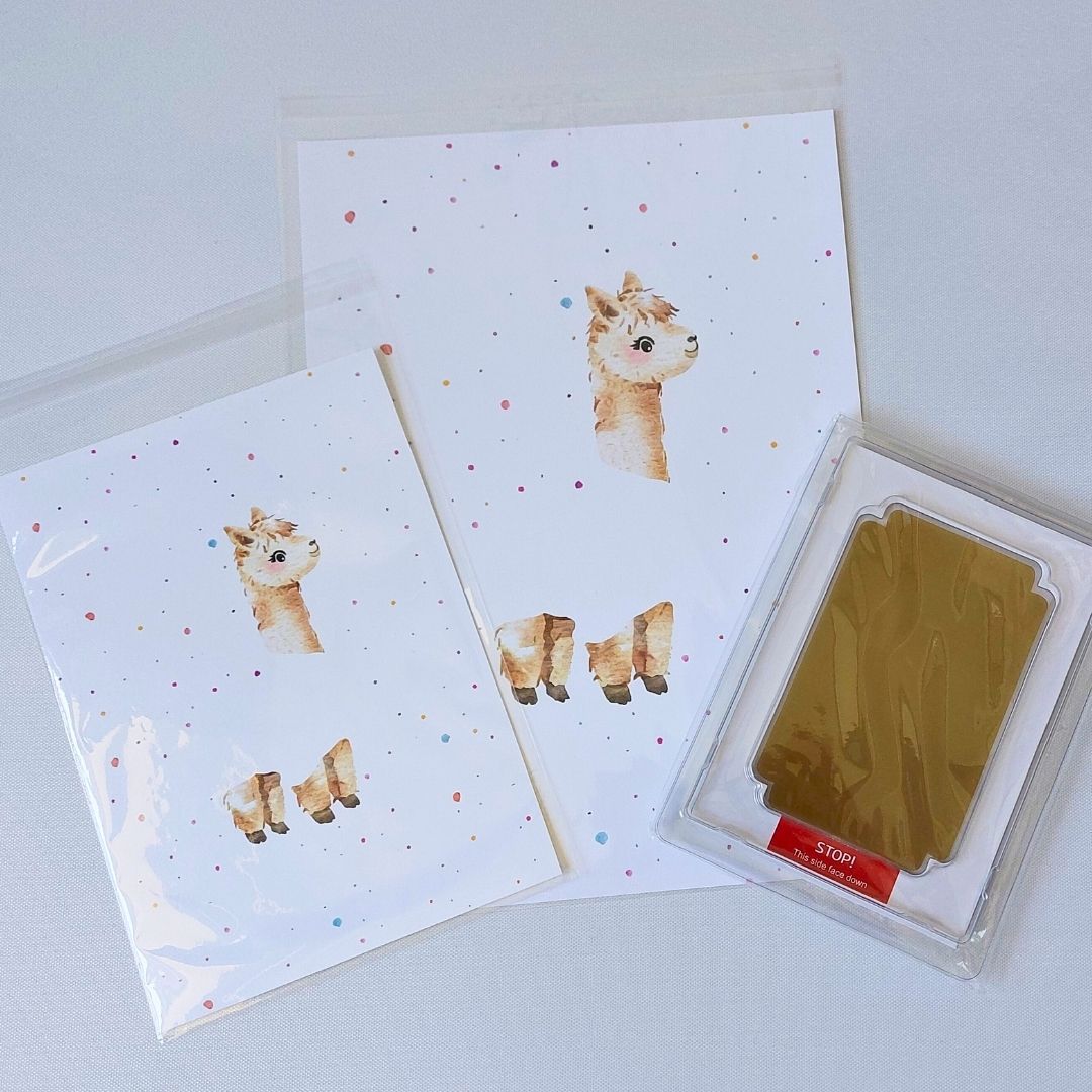 Illustrations of alpaca on A4 and A5 card. With brown clean touch ink pad and space for baby's footprint.