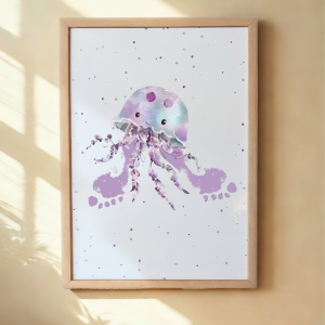 A framed print of a jellyfish with child's footprints as tentacles